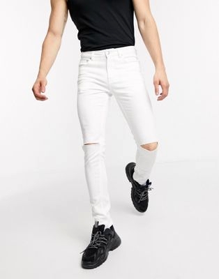 Белые супероблегающие джинсы с прорехами  Алексеевская